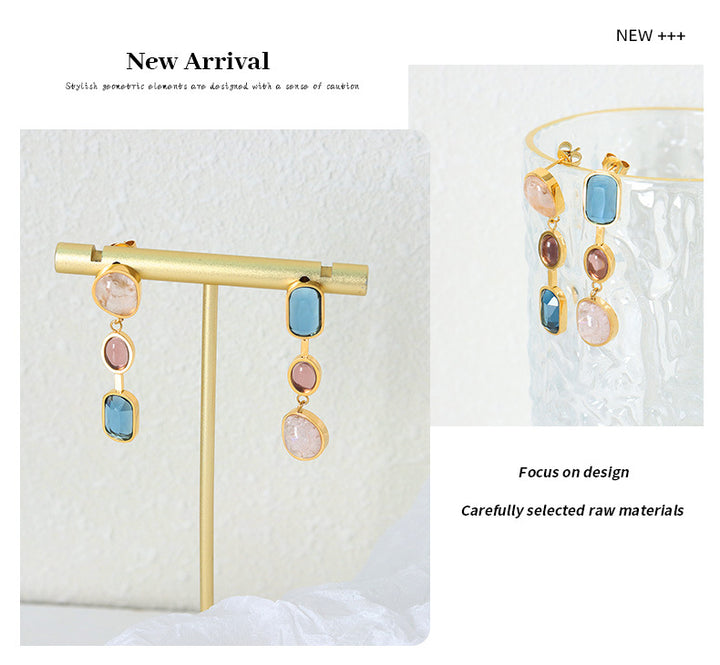 Gold earrings with colored crystals