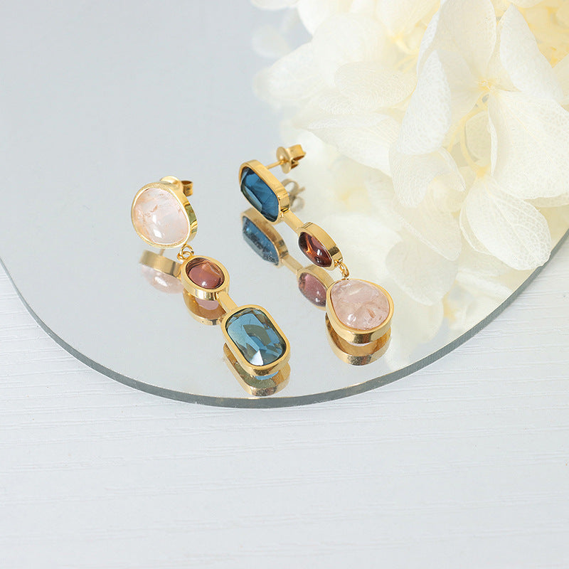 Gold earrings with colored crystals